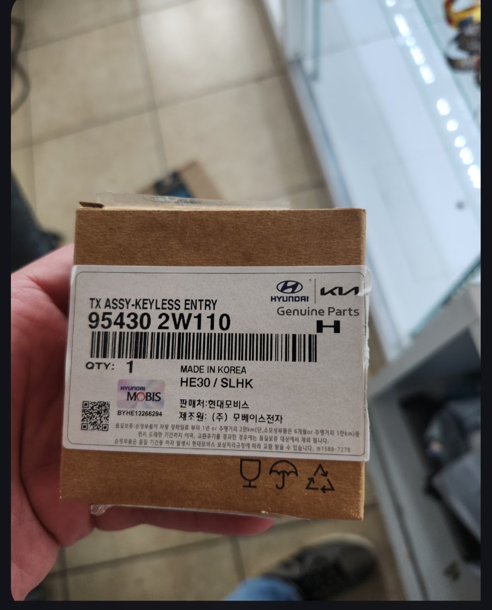 Genuine OEM Hyundai / Kia keyless entry key in the box, part 95430 2W110, supplied by Turbo Keysmith in the OKC metro